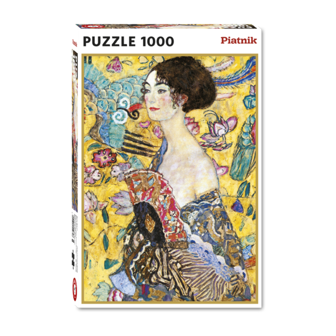 Das Bild zeigt die Schachtel des Puzzles "Dame mit Fächer" von Gustav Klimt, auf der das Motiv großflächig abgebildet ist.